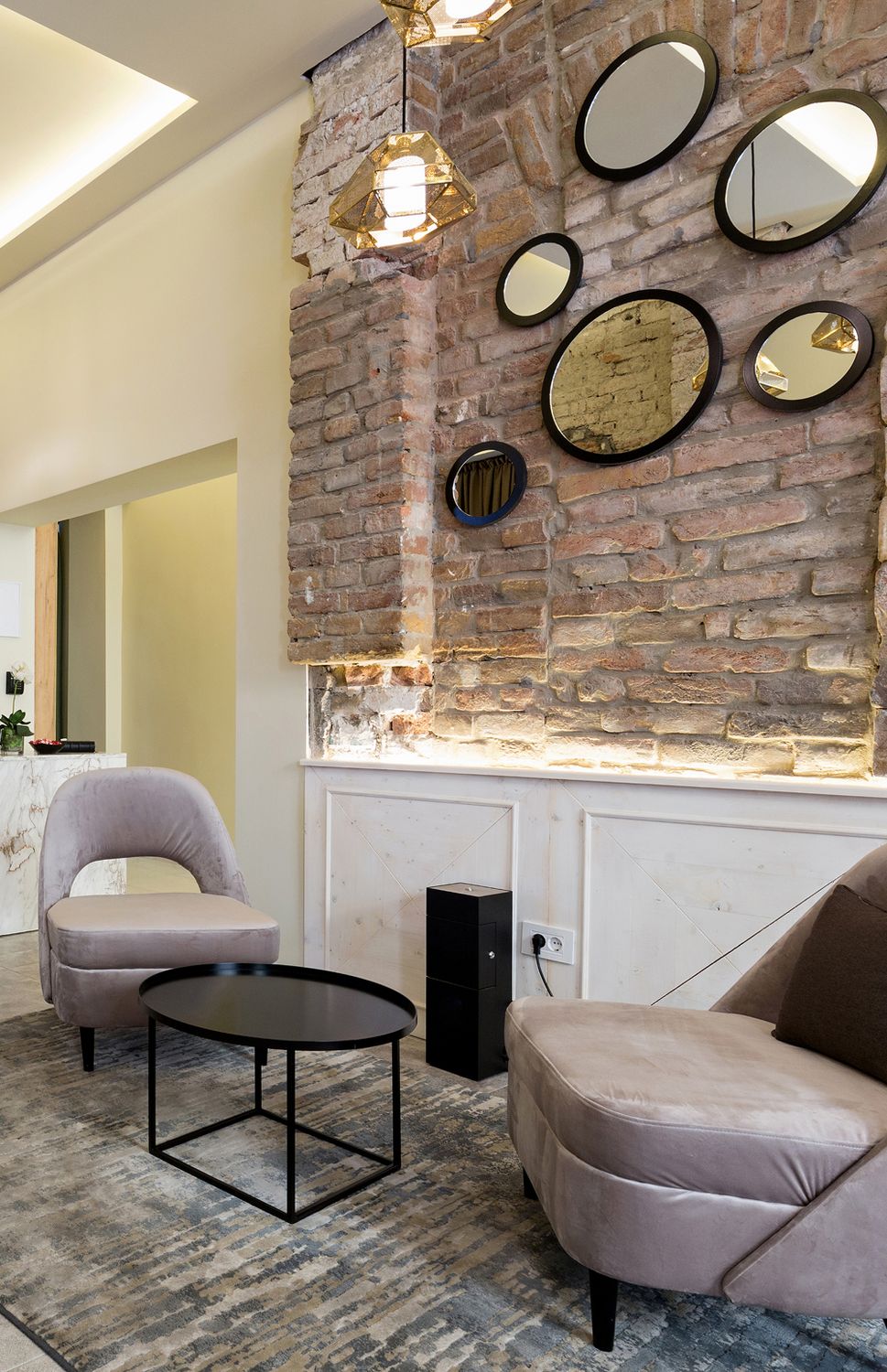 Cozy lounge area with stylish decor and lighting.